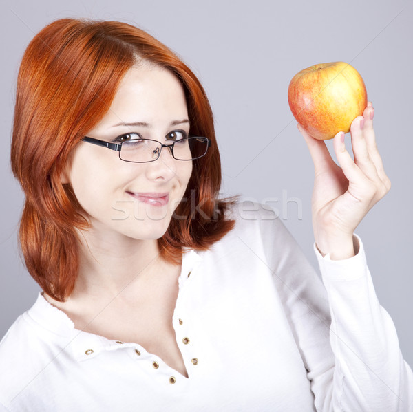 Girl With Apple In Hand Studio Shot Stock Photo C Volodymyr