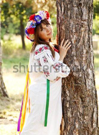 Slav girl with wreath at park. Stock photo © Massonforstock