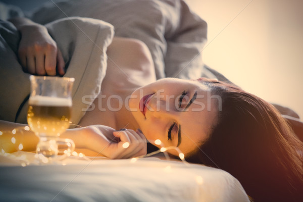 Beautiful rednead woman with cup of coffee or cappuccino in a be Stock photo © Massonforstock