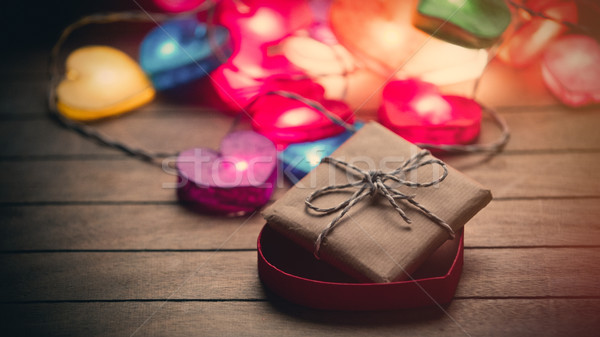 Stock photo: beautiful colorful heart shaped garland and gift in opened heart