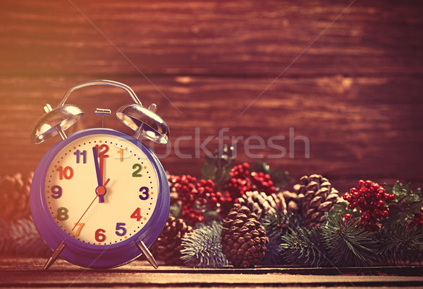 Alarm clock near Pine branches on wooden table. Stock photo © Massonforstock