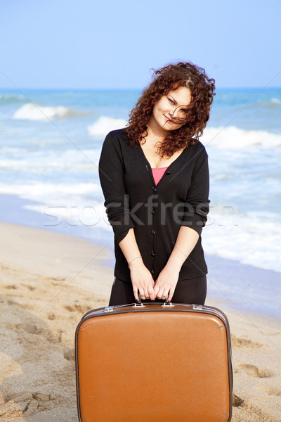 Redhead girl at outdoor with suitcase Stock photo © Massonforstock