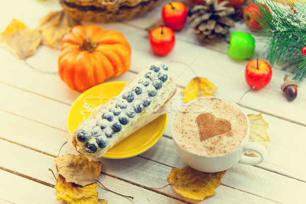 Eclair and cup of coffee  Stock photo © Massonforstock