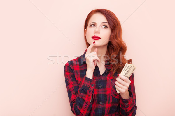 Kız para şaşırmış kırmızı elbise Stok fotoğraf © Massonforstock