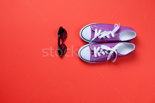 Violet gumshoes and glasses o Stock photo © Massonforstock