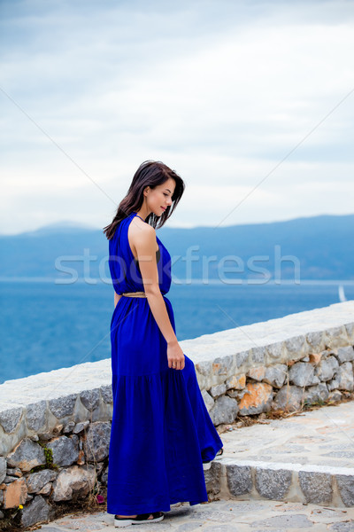 photo of beautiful young woman standing on the stairs  in Greece Stock photo © Massonforstock