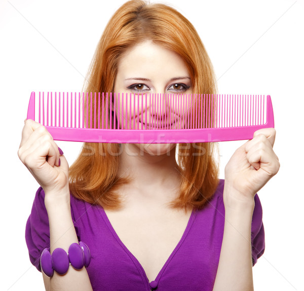 Funny red-haired girl with big comb. Stock photo © Massonforstock