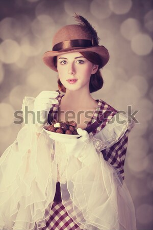 Housewife with iron and curler Stock photo © Massonforstock