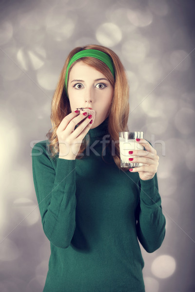 American redhead girl with milk and cake. Photo in 60s style Stock photo © Massonforstock