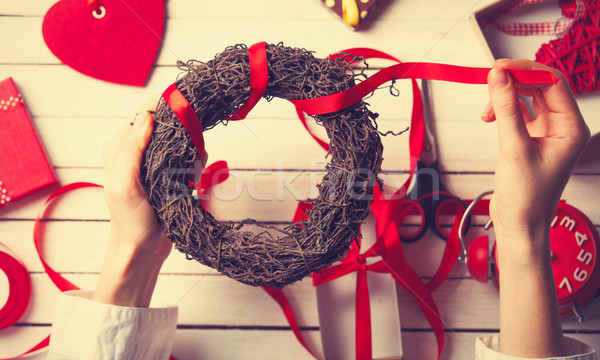 female hands wrapping wreath Stock photo © Massonforstock