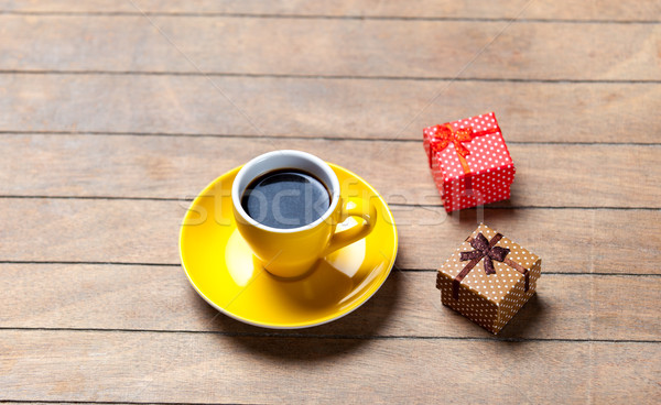 photo of cup of coffee and cute wrapped gifts on the wonderful b Stock photo © Massonforstock