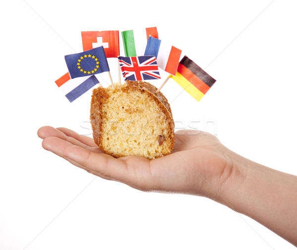 Hand keep cake with some european flags. Stock photo © Massonforstock