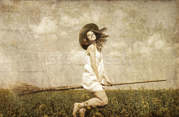 Vörös hajú nő légy tavasz mező seprű fotó Stock fotó © Massonforstock