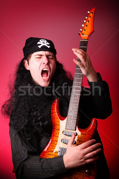 Rock pirate with guitar  Stock photo © Massonforstock