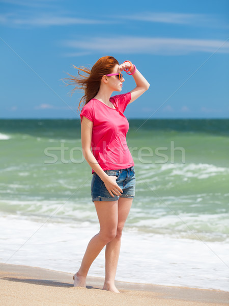 Redhead teen girl on the beach Stock photo © Massonforstock