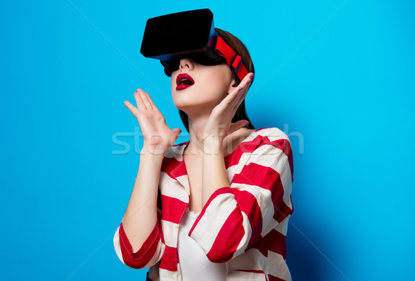 woman with virtual reality gadget Stock photo © Massonforstock