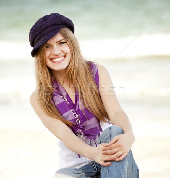 Stock photo: Funny teen girl near the sea.