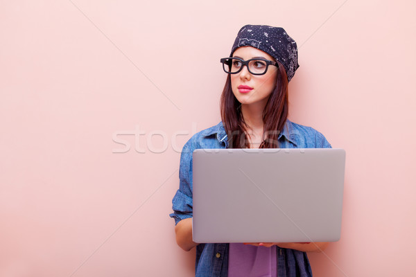 Stock photo: portrait of a young woman with laptop