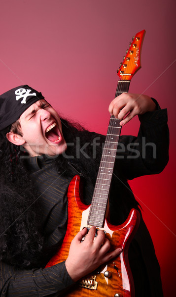 Rock pirate with guitar  Stock photo © Massonforstock