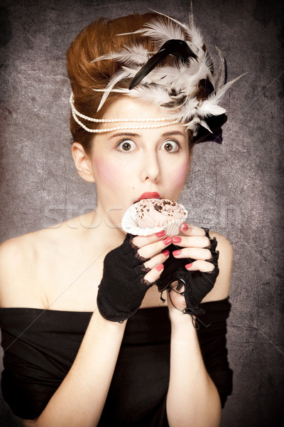 Redhead girl with Rococo hair style and cake in studio at vintag Stock photo © Massonforstock