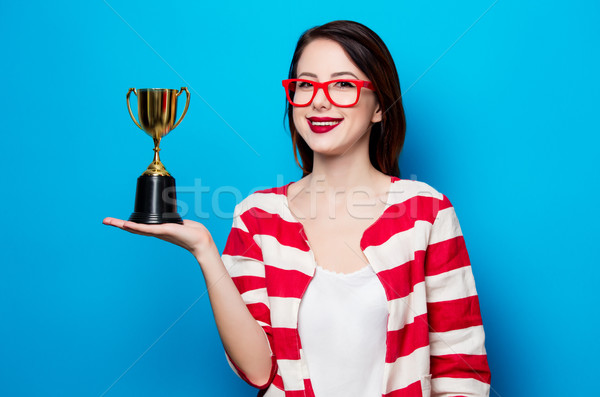 young smiling woman with cup trophy Stock photo © Massonforstock