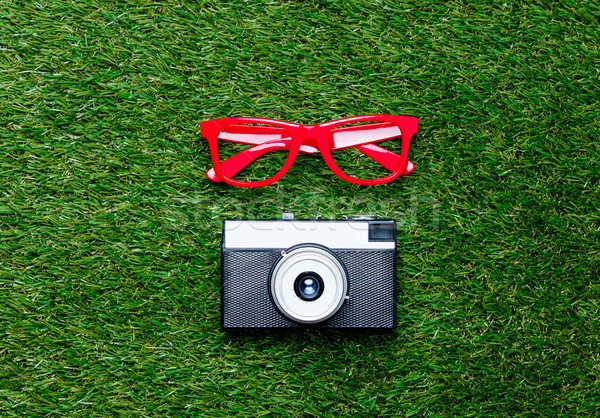 Vintage camera and red styled glasses Stock photo © Massonforstock