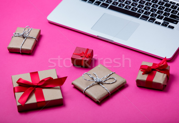 beautiful gifts of different sizes and cool laptop on the wonder Stock photo © Massonforstock