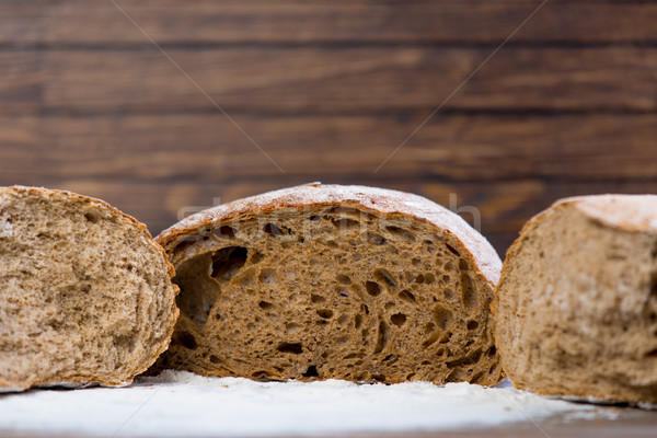 photo of tasty fresh bread loaves on the wonderful brown wooden  Stock photo © Massonforstock
