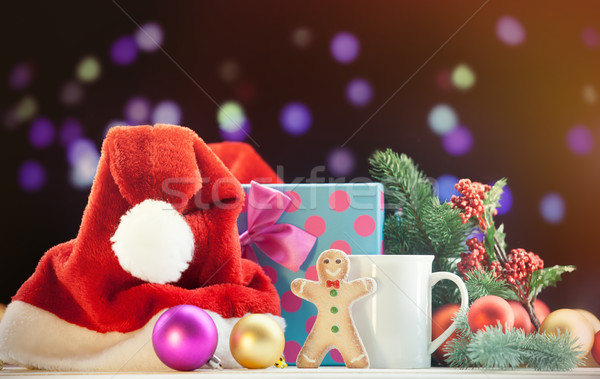 Santas hat and gingerbread with cup Stock photo © Massonforstock
