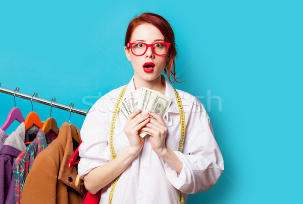 photo of beautiful young woman with centimeter and money near cl Stock photo © Massonforstock