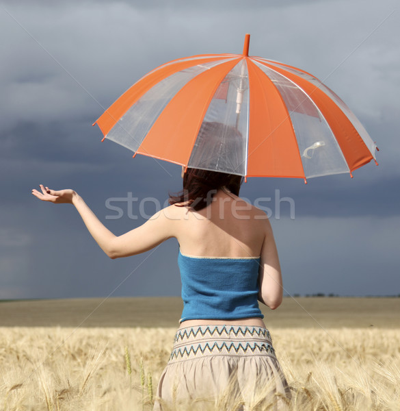 Menina campo de trigo tempestade dia guarda-chuva natureza Foto stock © Massonforstock
