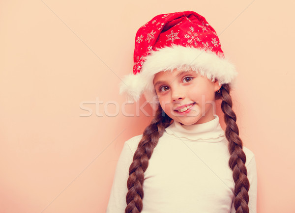 girl with pigtails in Santa Claus hat  Stock photo © Massonforstock