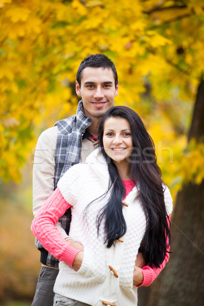 photo of cute couple hugging on the wonderful yellow trees backg Stock photo © Massonforstock