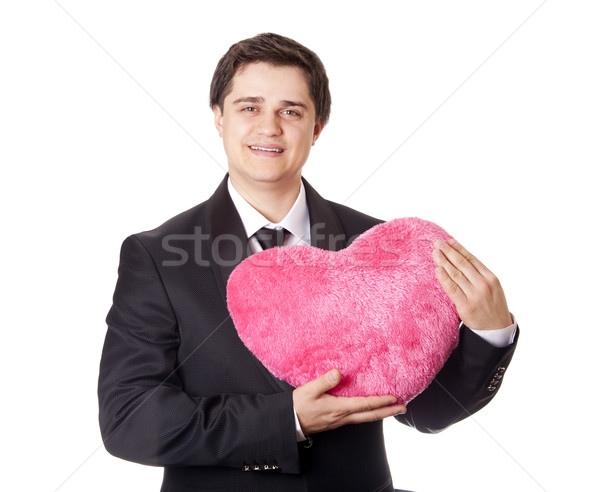 A man holding toy heart in formal black tux with tie isolated on Stock photo © Massonforstock