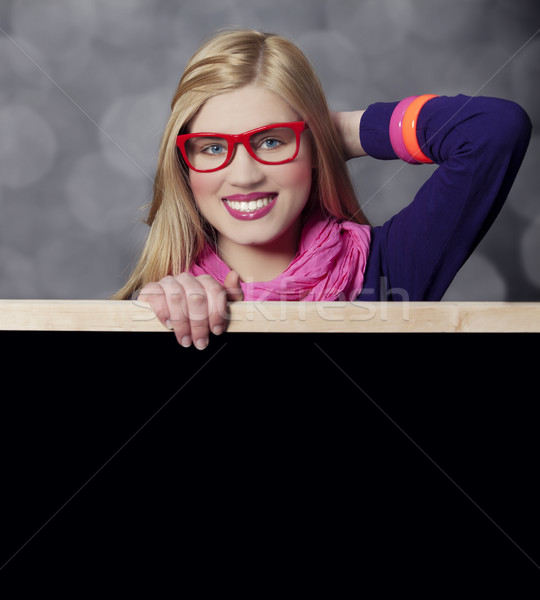 Smiling teen girl with blackboard. Stock photo © Massonforstock