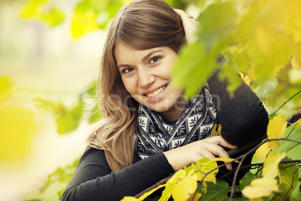 Stock photo: Beautiful girl at autumn park.