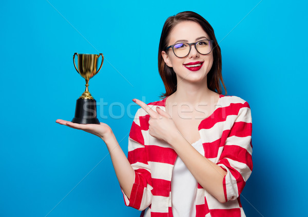 young smiling woman with cup trophy Stock photo © Massonforstock