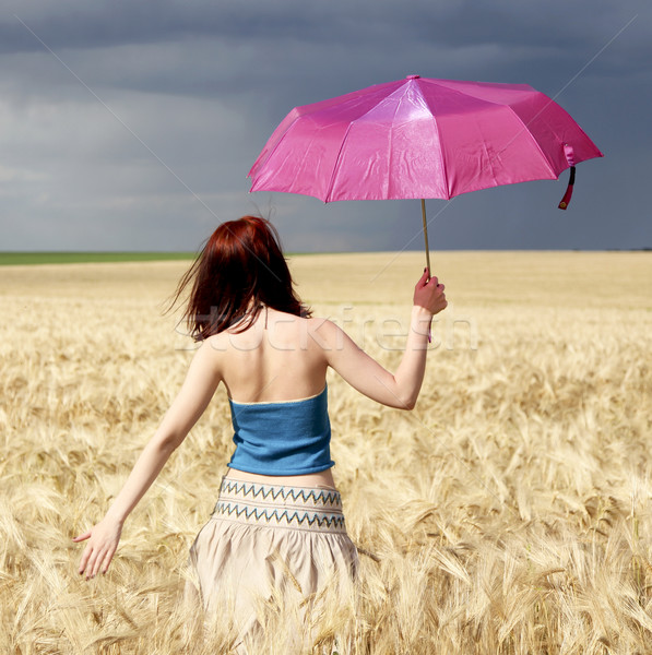 Dziewczyna pole pszenicy burzy dzień parasol charakter Zdjęcia stock © Massonforstock