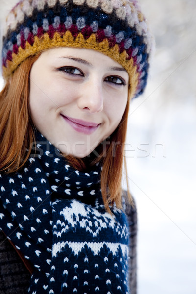 Beautiful young red-haired woman in winter park  Stock photo © Massonforstock