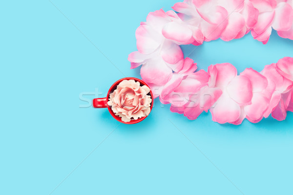 beautiful hawaiian lei and rose in red cup on the wonderful blue Stock photo © Massonforstock
