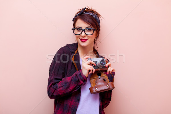 portrait of a young woman with camera Stock photo © Massonforstock