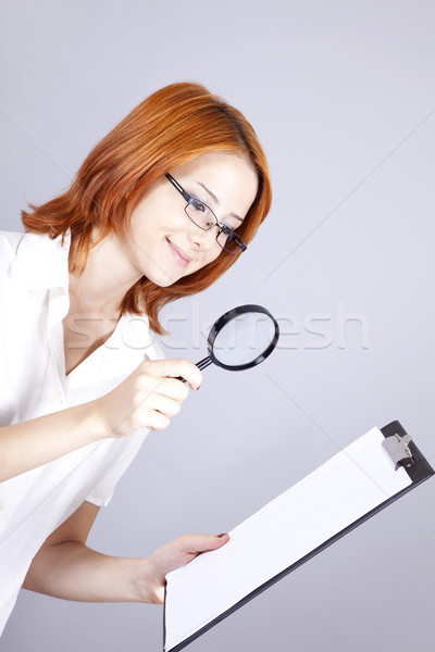 Stock photo: Young businesswomen with white plan board and loupe