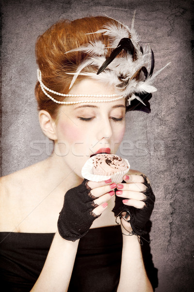 Redhead girl with Rococo hair style and cake in studio at vintag Stock photo © Massonforstock
