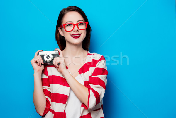 young smiling woman with retro camera Stock photo © Massonforstock