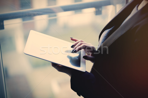 young caucasian female hands holding a tablet and typing text ne Stock photo © Massonforstock