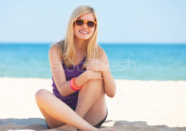 Beautiful blonde girl at the beach. Stock photo © Massonforstock