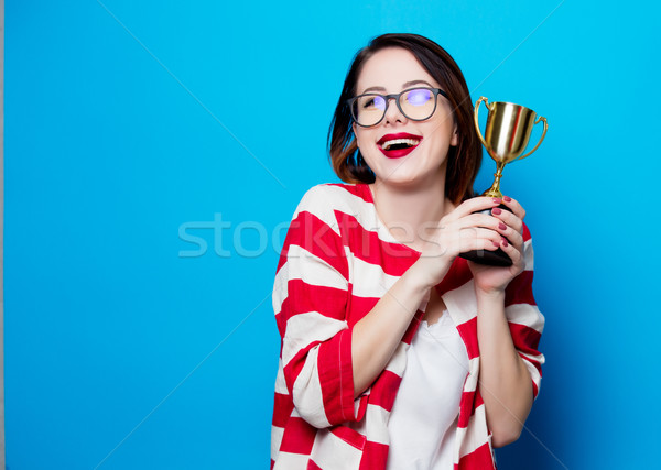 young smiling woman with cup trophy Stock photo © Massonforstock