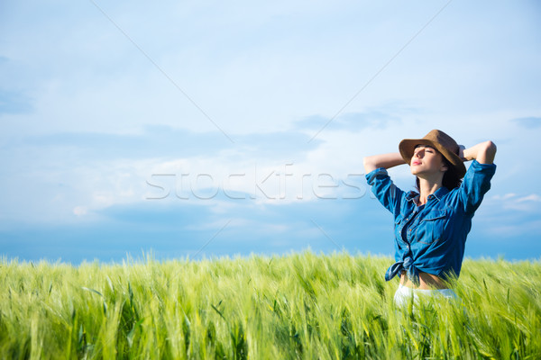 beautiful young woman standing in the middle of the wonderful gr Stock photo © Massonforstock