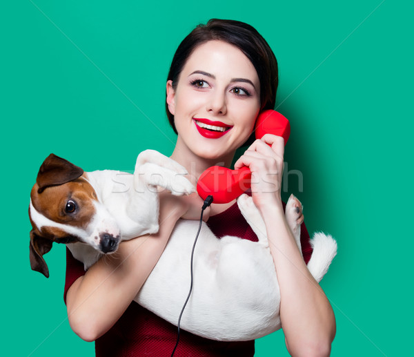woman with red handset and dog  Stock photo © Massonforstock