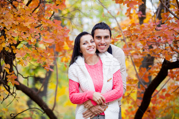 photo of cute couple hugging on the wonderful yellow trees backg Stock photo © Massonforstock